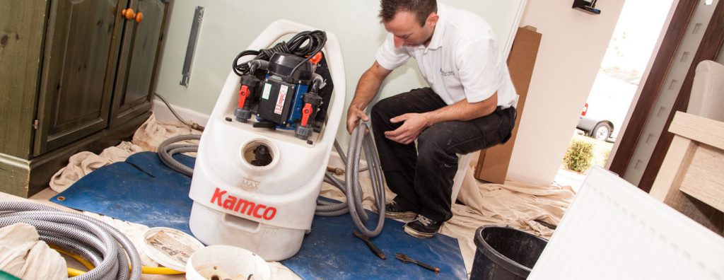 Plumbing Engineer completing a power-flush in a clients home